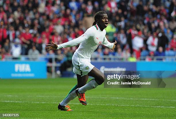 Ibrahima Balde of Senagal celebrates his goal during the London 2012 Olympic Qualifier between Senegal and Oman at Ricoh Arena on April 23, 2012 in...