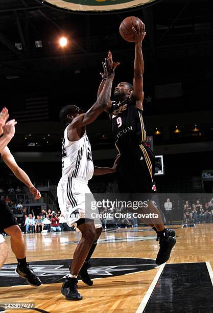 Keith McLeod of the Erie BayHawks shoots over Flip Murray of the Austin Toros in game three of the NDBL Playoffs on April 16, 2012 at the Cedar Park...