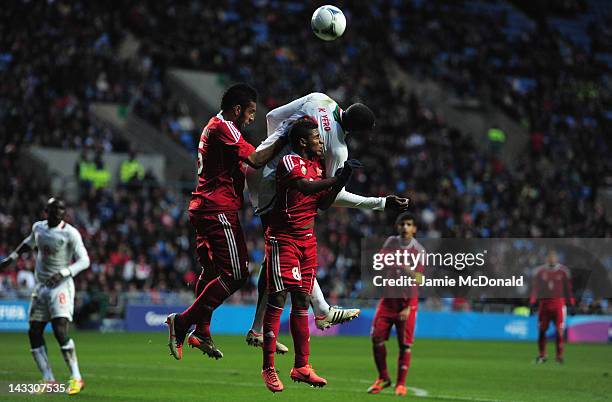 Kalidou Yero of Senagal battles with Mohammed Al Balushi and Ali Al Nahar of Oman during the London 2012 Olympic Qualifier between Senegal and Oman...