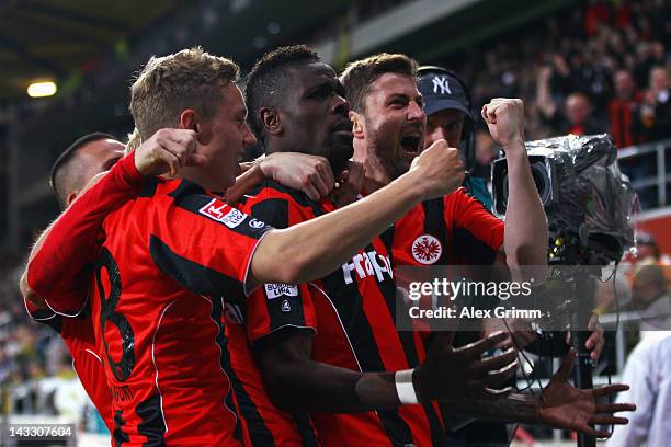 Mohamadou Idrissou of Frankfurt celebrates his team's second goal with team mates Sonny Kittel and Heiko Butscher during the Second Bundesliga match...