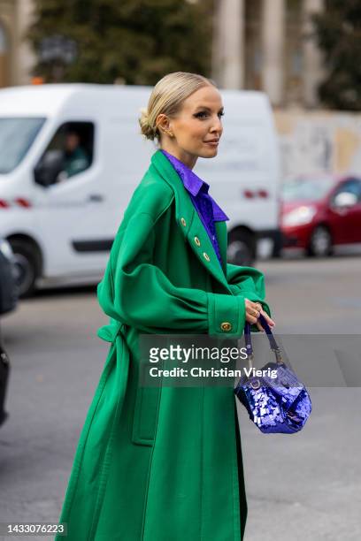Leonie Hanne wears green coat, Fendi bag, purple blouse, green mini skirt outside Zimmermann during Paris Fashion Week - Womenswear Spring/Summer...