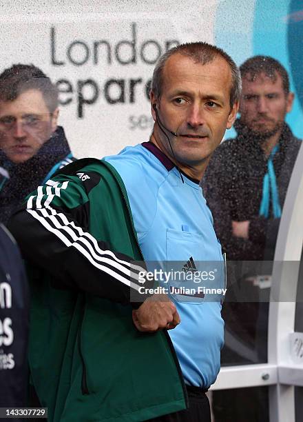 Fourth official, Martin Atkinson prepares for the match before the London 2012 Olympic Qualifier match between Senegal and Oman at the Ricoh Arena on...