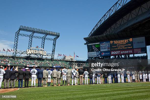 Members of the military take part in Salute to Armed Forces Day prior to the game between the Seattle Mariners and the Chicago White Sox at Safeco...