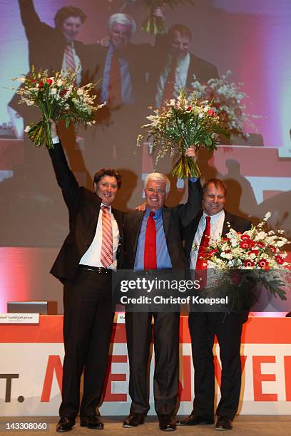 Vice-president Toni Schumacher, new president Werner Spinner and vice-president Markus Ritterbach pose after being voted during the extraordinary...