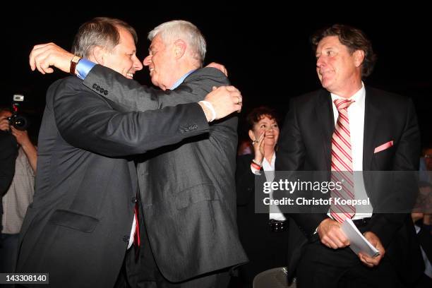 Markus Ritterbach, vice-president, Werner Spinner, president and Toni Schumacher, vice-president celebrate after bein voted during the extraordinary...