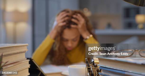 student with headache from education stress, tired of studying and burnout from learning for university exam with books in home. girl with autism, anxiety and depression confused about school project - student journalist stock pictures, royalty-free photos & images