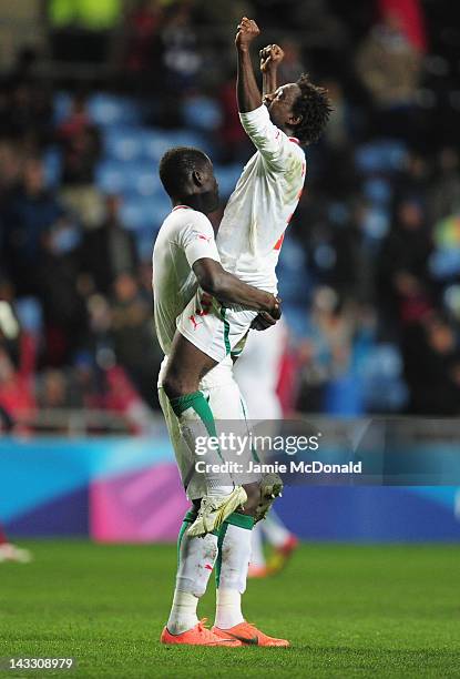 Players of Senagal celebrate progressing to the Olympic games during the London 2012 Olympic Qualifier between Senegal and Oman at Ricoh Arena on...