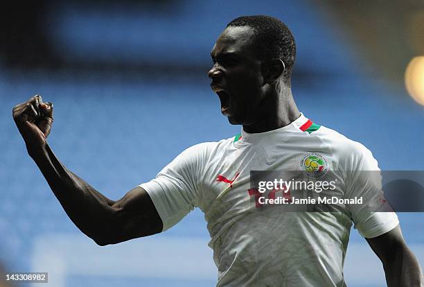 Moussa Konate of Senagal celebrates progressing to the Olympic games during the London 2012 Olympic Qualifier between Senegal and Oman at Ricoh Arena...