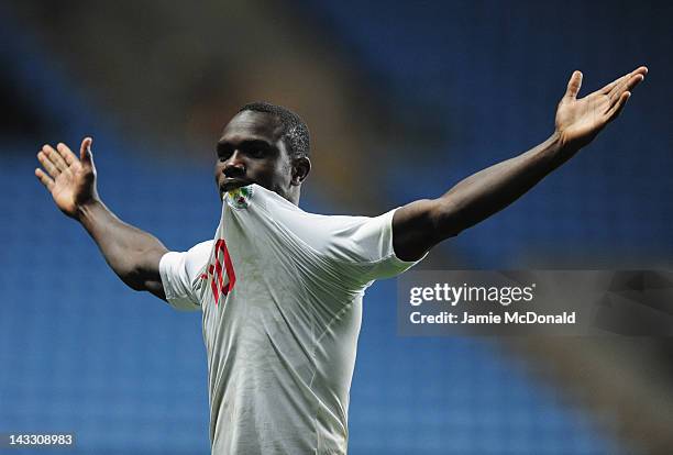 Moussa Konate of Senagal celebrates progressing to the Olympic games during the London 2012 Olympic Qualifier between Senegal and Oman at Ricoh Arena...