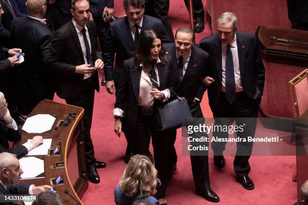 Senators Daniela Santanche' and Maurizio Gasparri help newly elected senator Silvio Belrusconi during the first Senate session of the XIX...