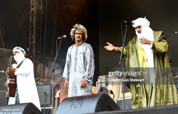 Ibrahim Ag Alhabi, Abdallah Ag Alhousseyni and Elaga Ag Hamid of Tinariwen perform on the west stage at Victoria Park on August 28, 2022 in London,...