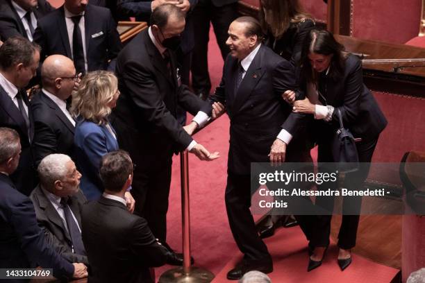 Senators Daniela Santanche' and Maurizio Gasparri help newly elected senator Silvio Belrusconi during the first Senate session of the XIX...