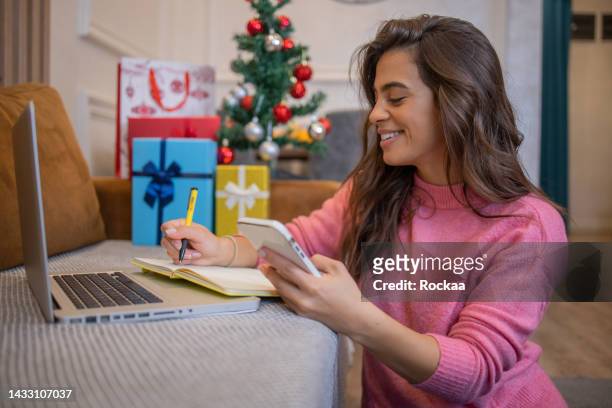 happy woman celebrating christmas - christmas budget stock pictures, royalty-free photos & images