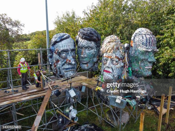 Workers begin dismantling the Mount Recyclemore sculpture at The Eden Project on October 13, 2022 in Par, England. The installation "Mount...