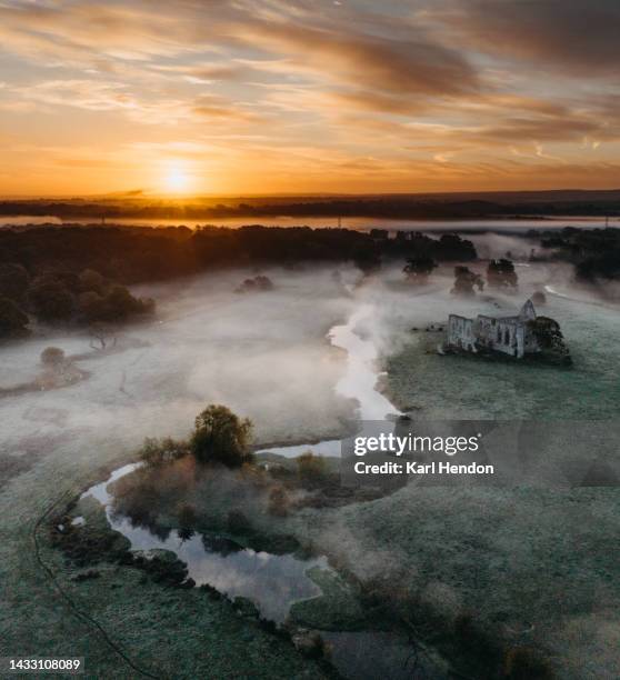 an aerial sunrise view newark abbey ruins, surrey - riverbank stock pictures, royalty-free photos & images