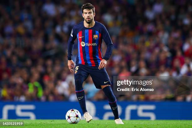 Gerard Pique of FC Barcelona runs with the ball during the UEFA Champions League group C match between FC Barcelona and FC Internazionale at Spotify...
