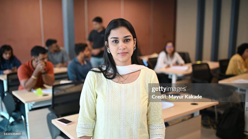 Portrait of a young woman in an adult education classroom; adult learners; Advance Education