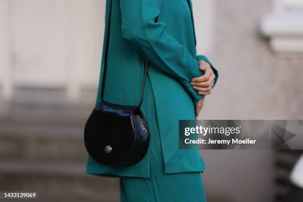 Anna Wolfers wearing a green look and a black bag on October 06, 2022 in Hamburg, Germany.