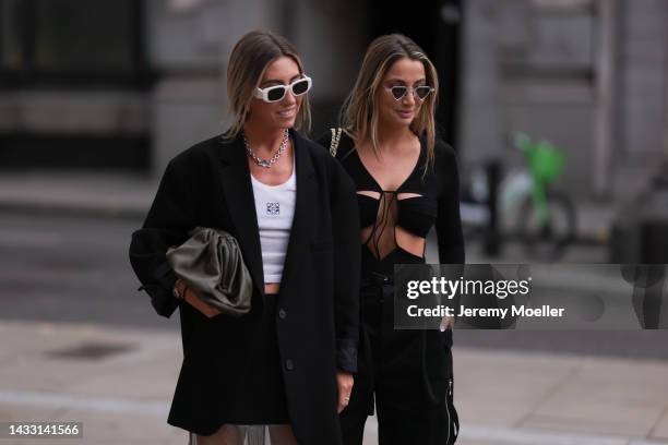 Hannah Lewis and Nadia Phillips seen wearing Bottega Veneta trousers, Loewe shirt, The Frankie shop blazer, Prada skirt and Nensi Dojaka top, outside...