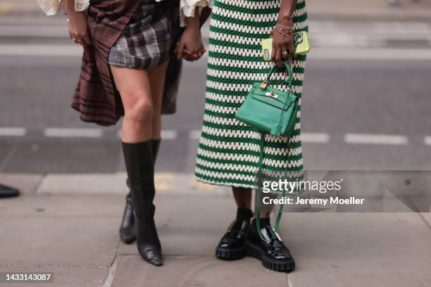 Fashion week guest's seen wearing colorful looks with a green Hermes kelly bag, outside Halpern Show during London Fashion Week, on September 18,...