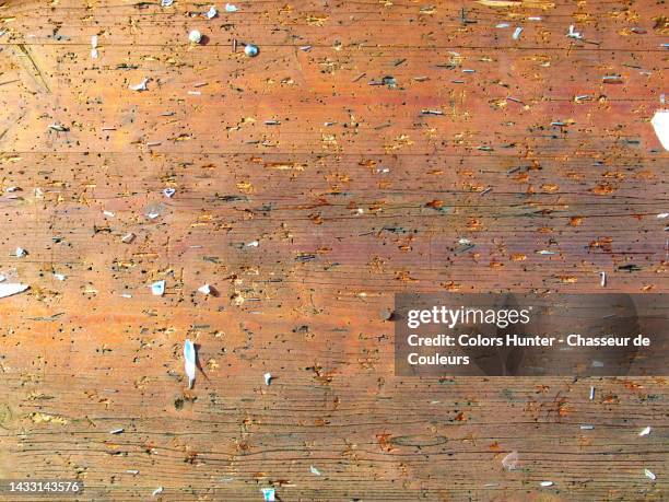 empty wooden notice board with push pins and staples in paris, france - anschlagbrett stock-fotos und bilder