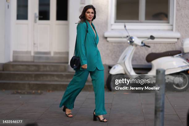 Anna Wolfers wearing a green look and a black bag on October 06, 2022 in Hamburg, Germany.