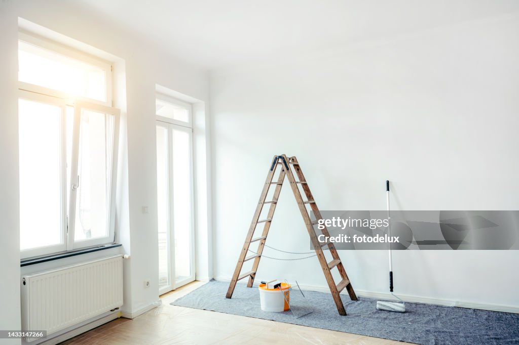 Renovate living room with color bucket and ladder