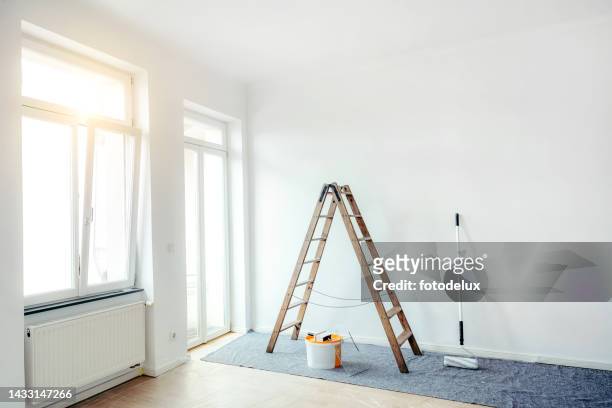 renovate living room with color bucket and ladder - renovering bildbanksfoton och bilder
