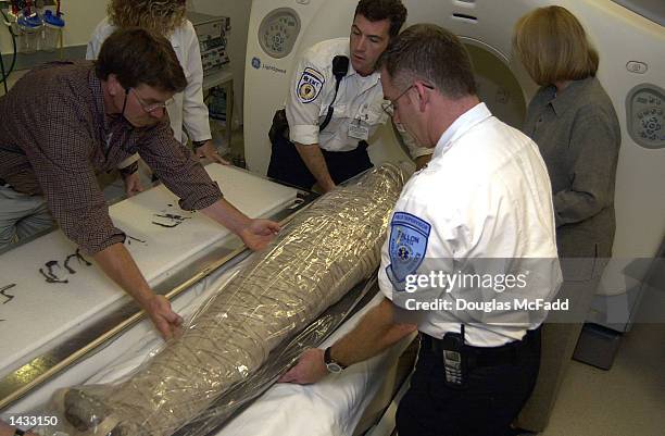 An unidentified mummy from the Museum of Science is prepared for a CT scan at the Beth Israel Deaconess Medical Center September 26, 2002 in Boston,...