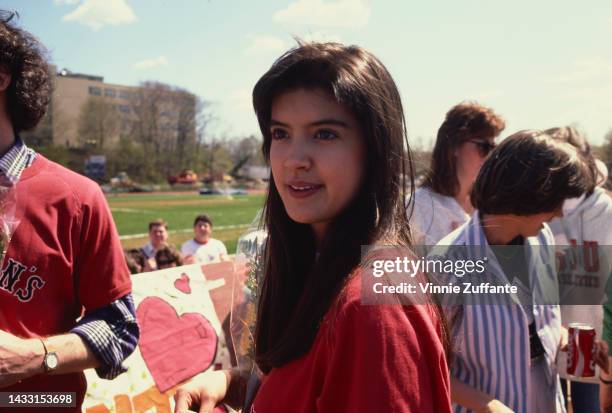 Phoebe Cates in front of the university football field wearing a 'St. John's' sweatshirt at St. John's University in New York, United States, 22nd...