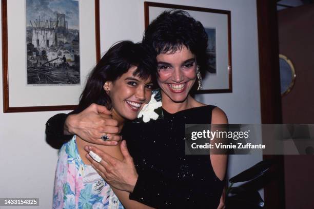 Phoebe Cates and Brooke Adams embracing, United States, circa 1980s.