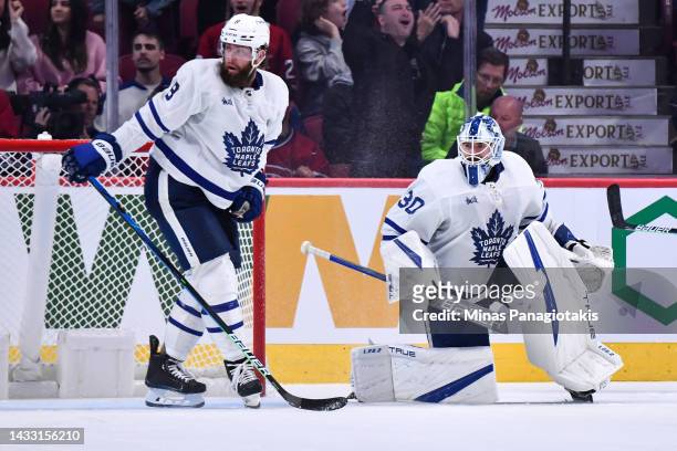 Goaltender Matt Murray of the Toronto Maple Leafs is out of position as teammate Jake Muzzin skates in during the third period against the Montreal...
