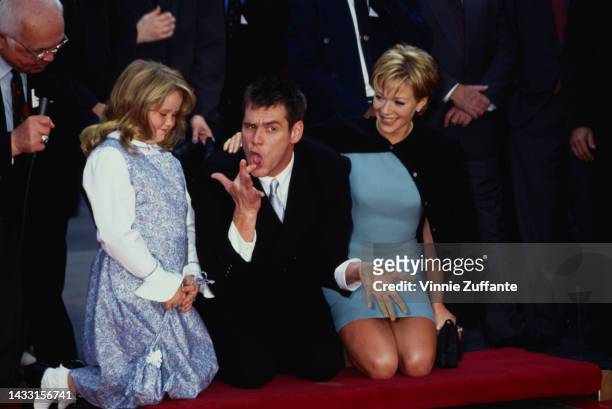 Jim Carrey, his daughter Jane and Lauren Holly during Jim Carrey Footprint Ceremony at Mann's Chinese Theatre in Hollywood, California, United...
