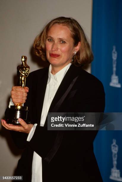 New Zealander film director Jane Campion poses with her Oscar statuette for Best Writing, Screenplay Written Directly for the Screen for her film,...