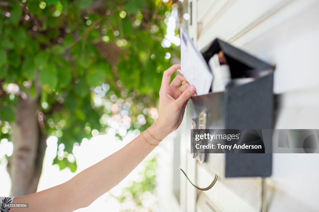 Close view of arm reaching for mail