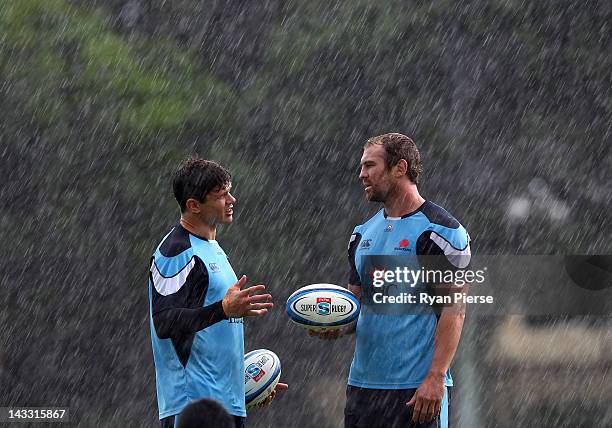 Tom Carter speaks with Rocky Elsom during a Waratahs Super Rugby training session at Moore Park on April 24, 2012 in Sydney, Australia.