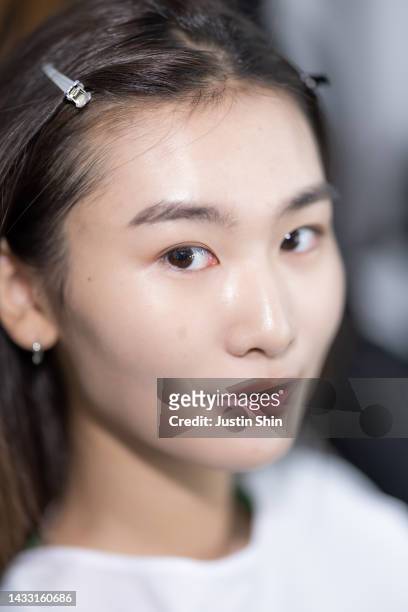Model prepares backstage ahead of the CAHIERS show at Seoul Fashion Week SS 23 on October 13, 2022 in Seoul, South Korea.
