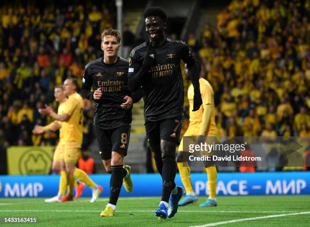 Bukayo Saka of Arsenal celebrates scoring their side's first goal during the UEFA Europa League group A match between FK Bodo/Glimt and Arsenal FC at...