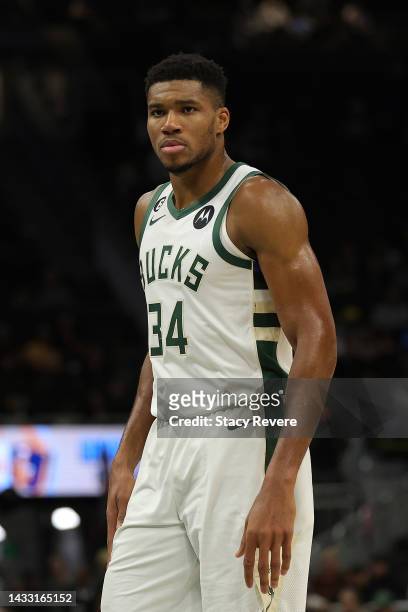 Giannis Antetokounmpo of the Milwaukee Bucks walks backcourt during a preseason game against the Brooklyn Nets at Fiserv Forum on October 12, 2022 in...