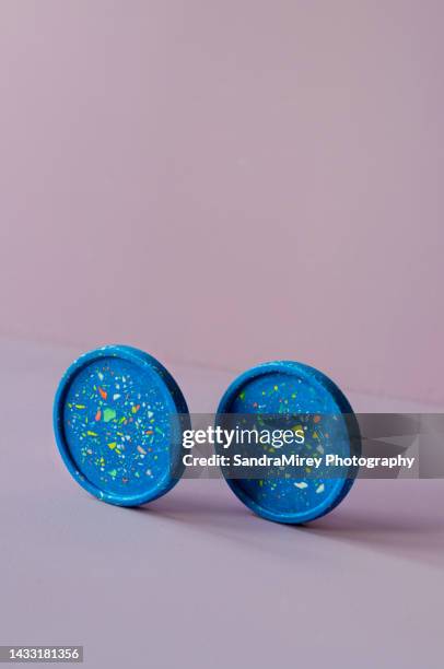 high angle view of beer and cocktail coaster, on pastel light lilac background. minimalist product display. spring aesthetic. copy space - terrazzo stock pictures, royalty-free photos & images