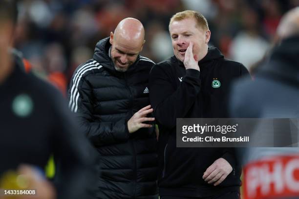 Erik ten Hag, Manager of Manchester United speaks to Neil Lennon, Head Coach of Omonia Nicosia prior to the UEFA Europa League group E match between...