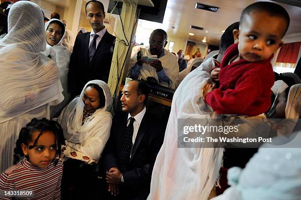 October 2, 2011: Prince Ermias Sahle-Salessie, center, and his wife, Saba Kebede, center left, remain seated as others leave the Hamere Noah Kidane...