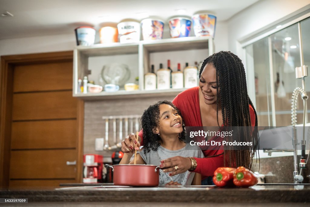 Mother and daughter cooking