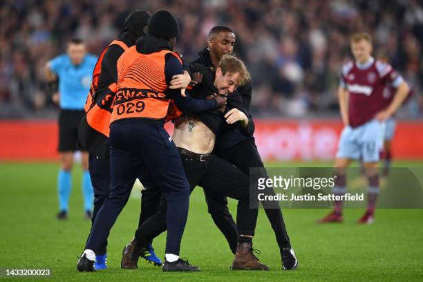 Pitch invader is seen during the UEFA Europa Conference League group B match between West Ham United and RSC Anderlecht at London Stadium on October...
