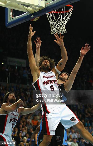 Matthew Knight of the Wildcats and Alex Pledger of the Breakers contest the ball during game three of the NBL Grand Final series between the New...