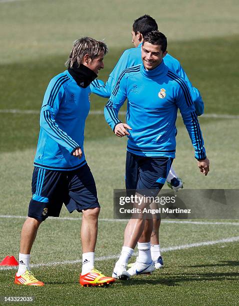 Cristiano Ronaldo of Real Madrid chats with Fabio Coentrao during a training session ahead of the UEFA Champions League Semi Final second leg match...