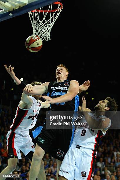 Gary Wilkinson of the Breakers and Matthew Knight of the Wildcats compete for the ball during game three of the NBL Grand Final series between the...