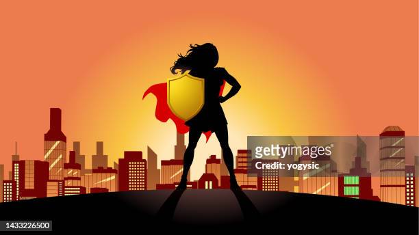 stockillustraties, clipart, cartoons en iconen met vector female superhero silhouette holding a shield with city skyline in the background stock illustration - heldin