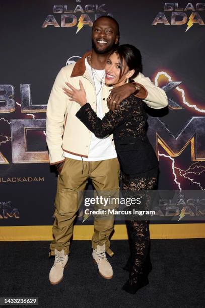 Aldis Hodge and Sarah Shahi attend the BLACK ADAM Red Carpet Screening Atlanta at Regal Atlantic Station on October 13, 2022 in Atlanta, Georgia.