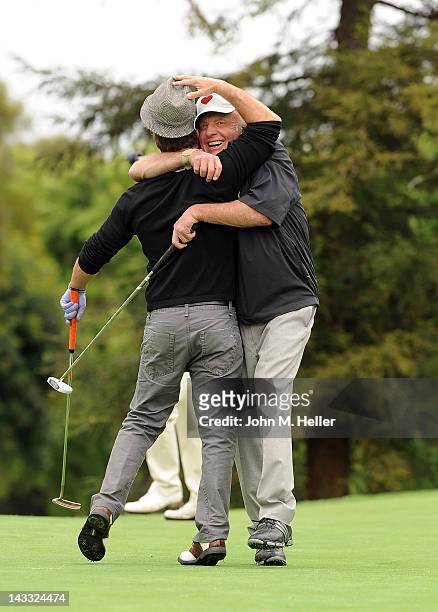 Actor Scott Caan give his father actor James Caan a hug after making an eagle on the eighth hole at the 9th Annual James Caan Golf Classic at the El...